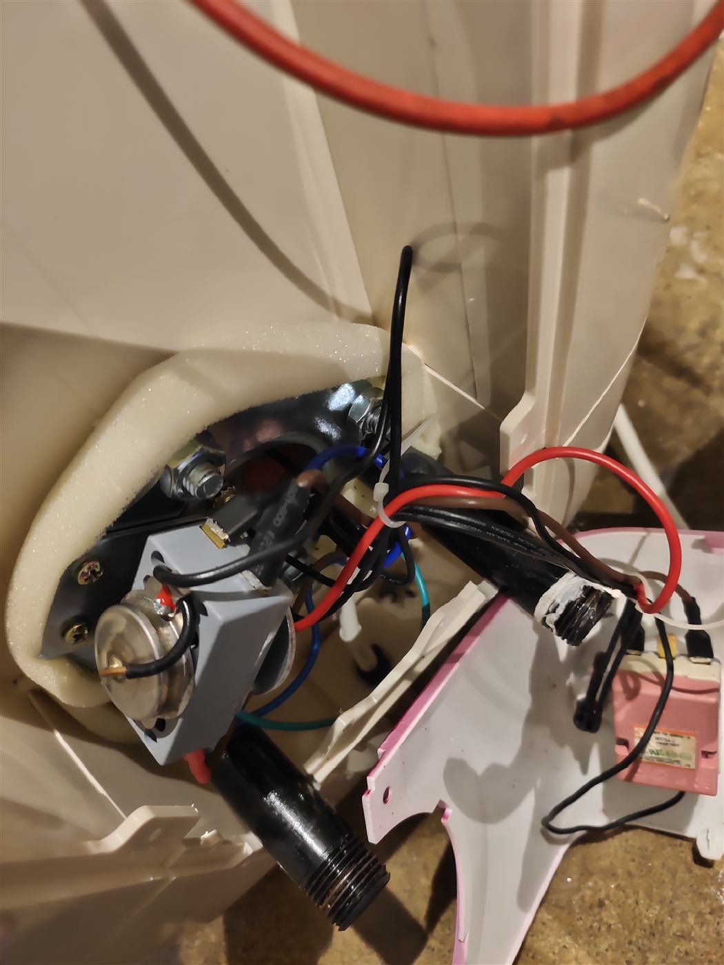 Geyser heating element and internal wiring exposed during a repair in Kamareddy