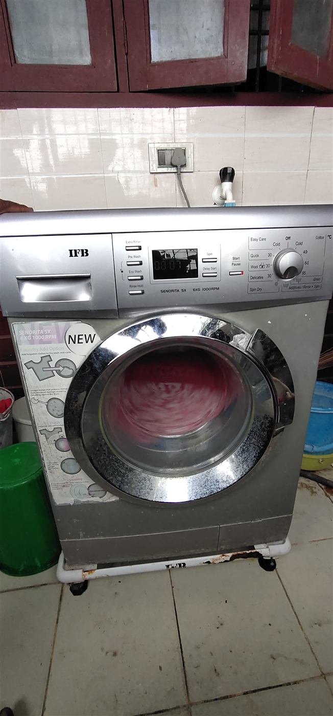 IFB washing machine running a spin cycle after repair in Kamareddy